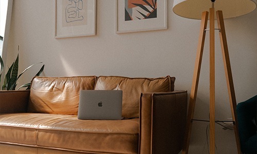 open laptop on living room couch